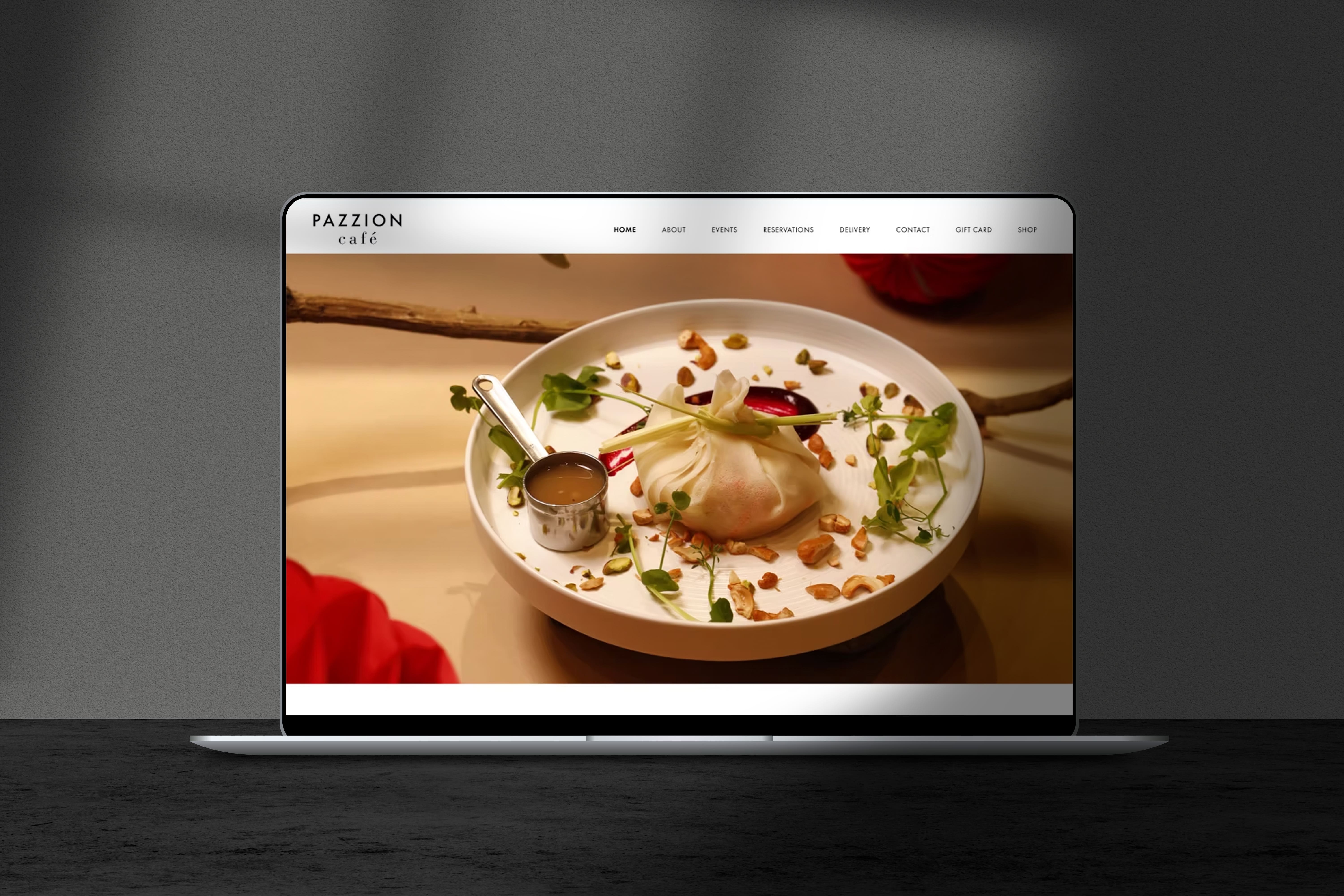Pazzion Café website homepage on a laptop